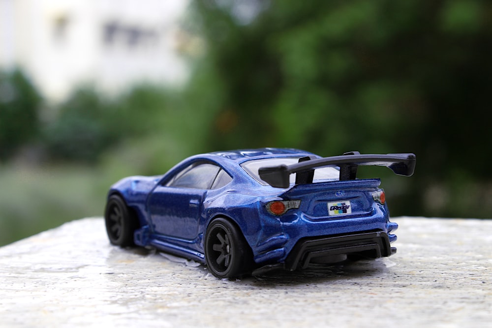 blue porsche 911 on road during daytime