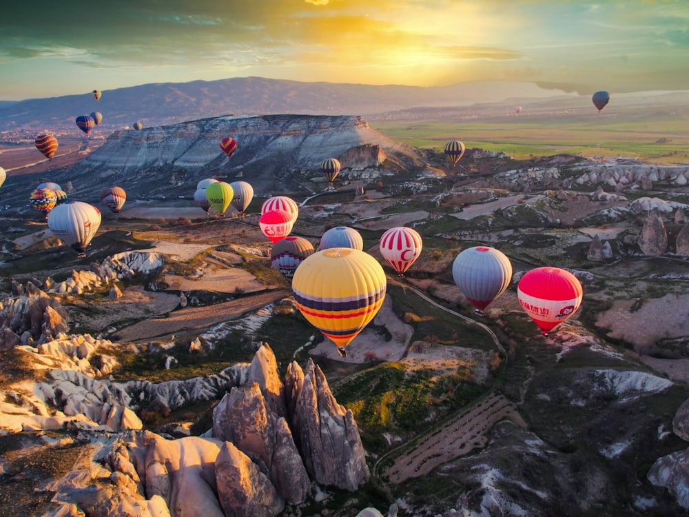 hot air balloons on the top of the mountain