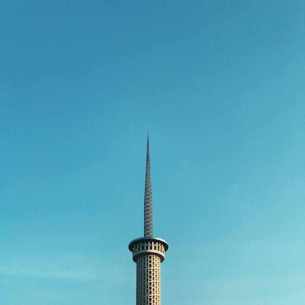 white and green concrete building under blue sky during daytime