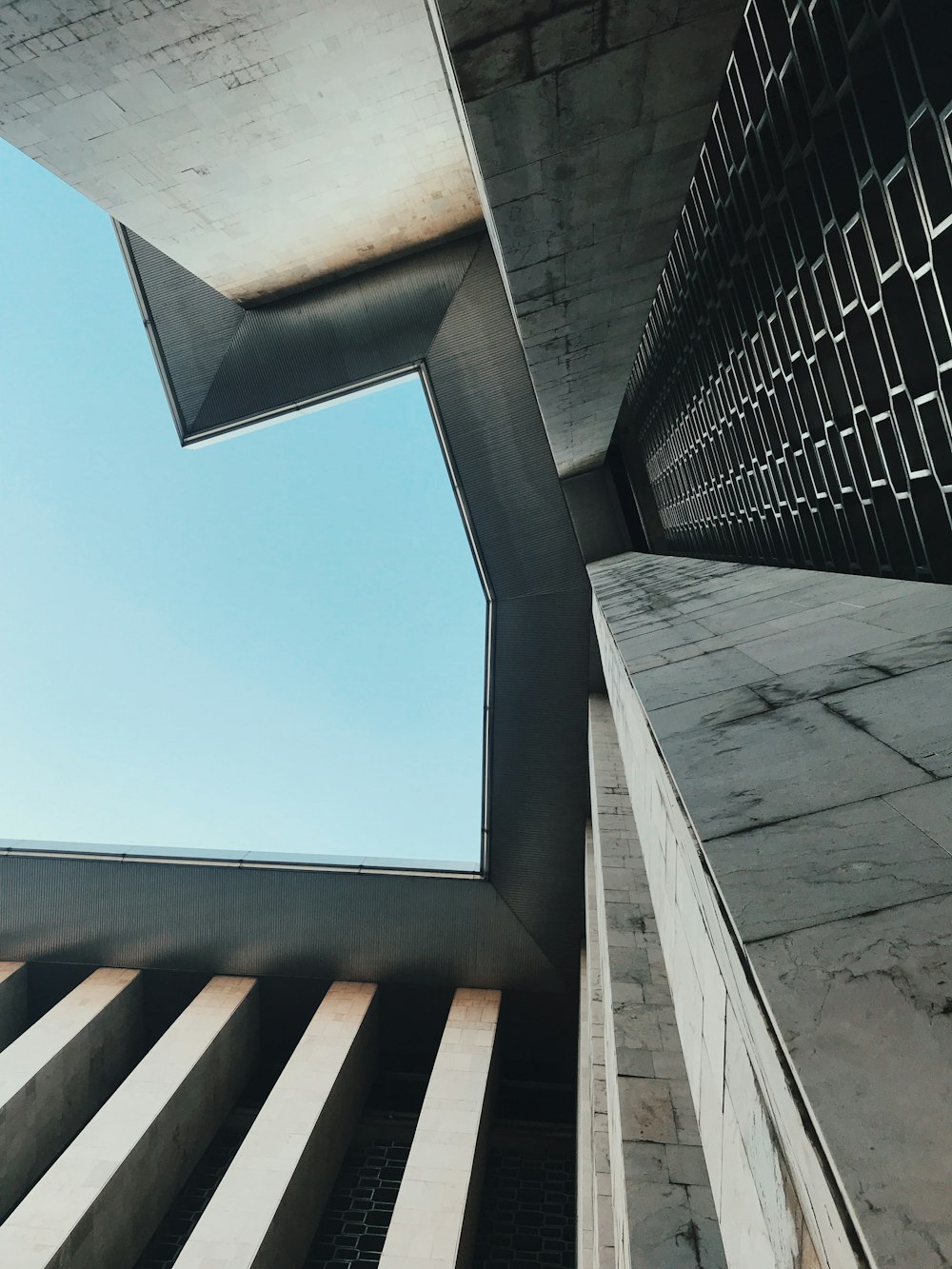 gray concrete building under blue sky during daytime