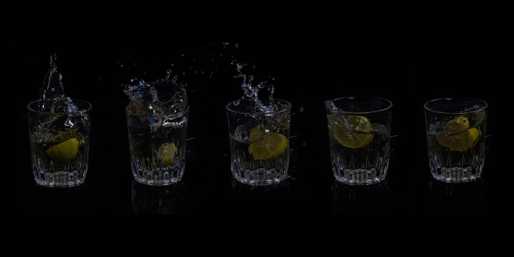 3 clear shot glasses with ice
