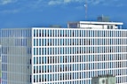 white and blue concrete building under blue sky during daytime