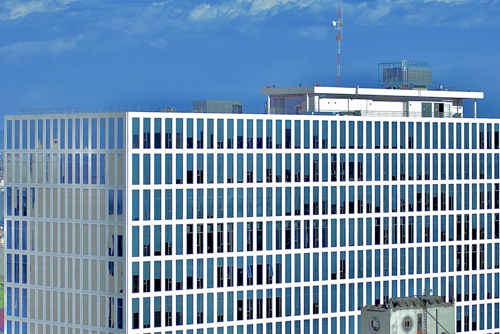 white and blue concrete building under blue sky during daytime