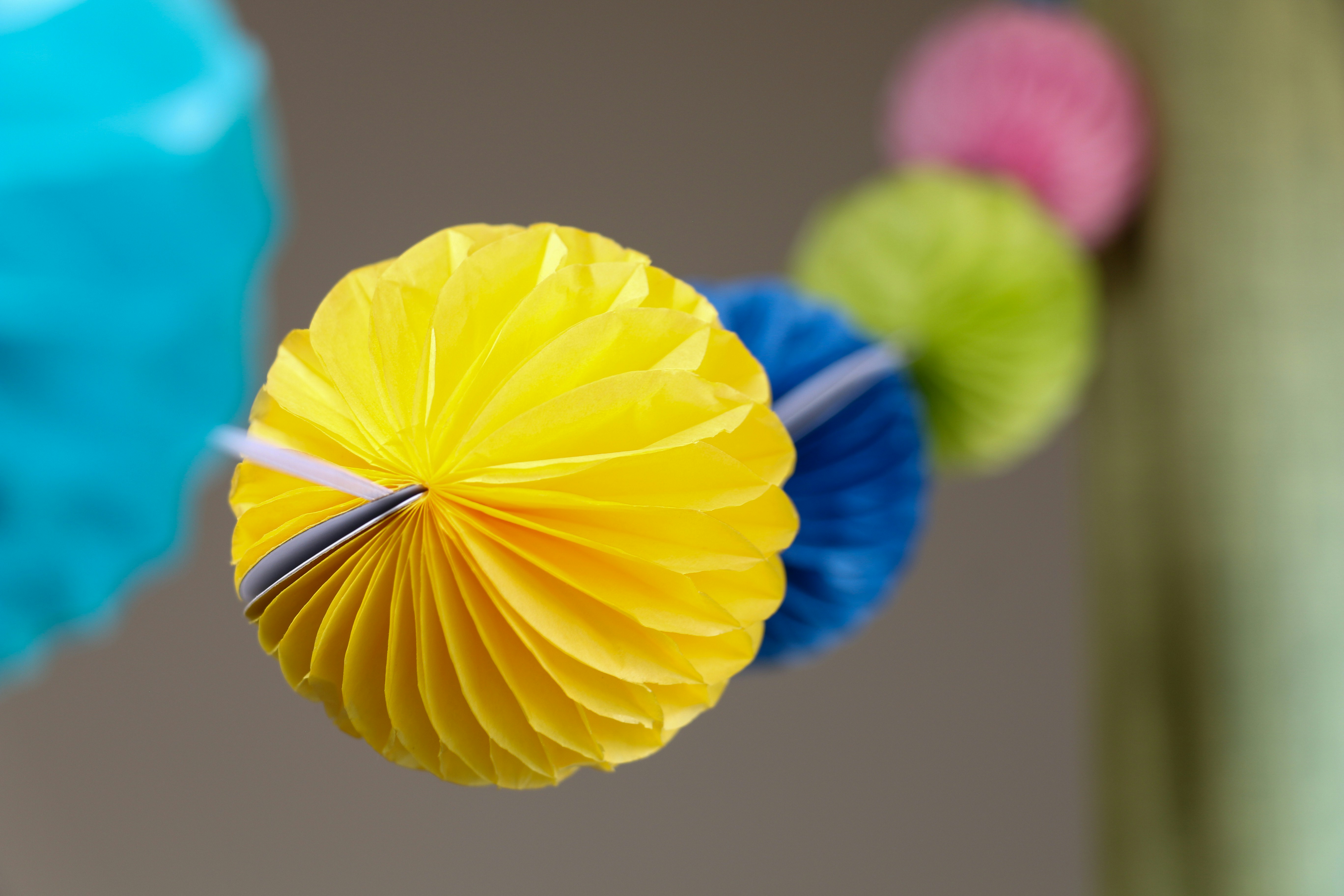 DIY Paper Lantern Cluster DIY home decor project — yellow blue and pink umbrella