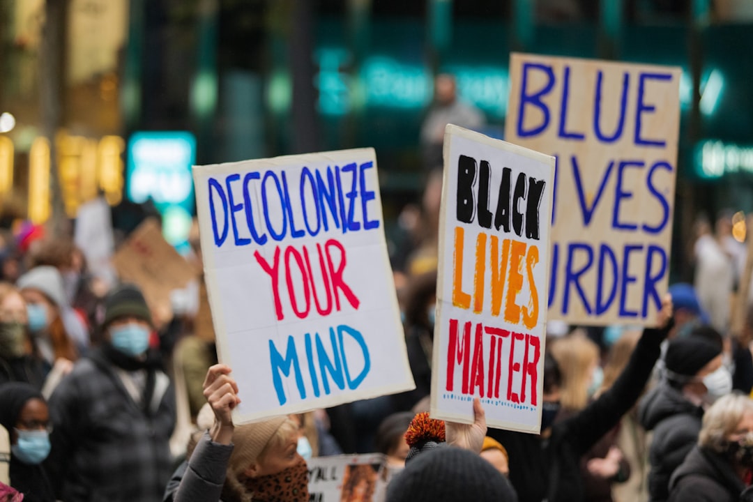 person holding white and blue happy birthday signage