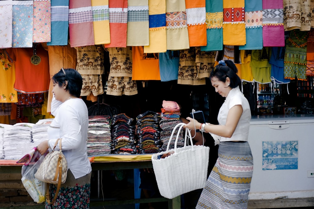 woman in white t-shirt holding blue and yellow wicker basket