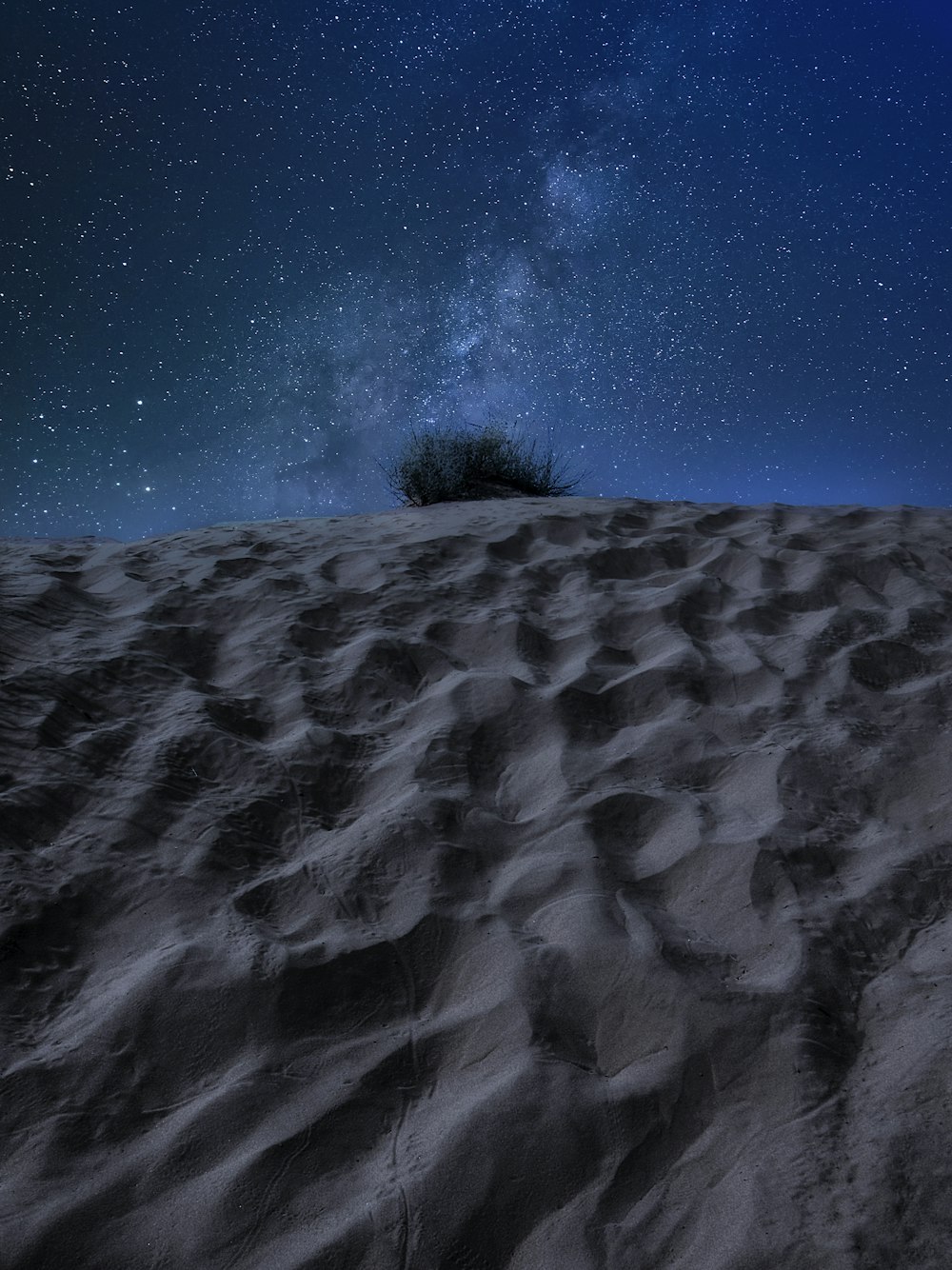 gray sand under blue sky