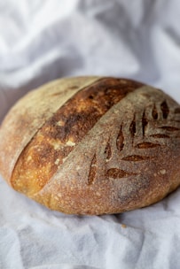 brown bread on white textile