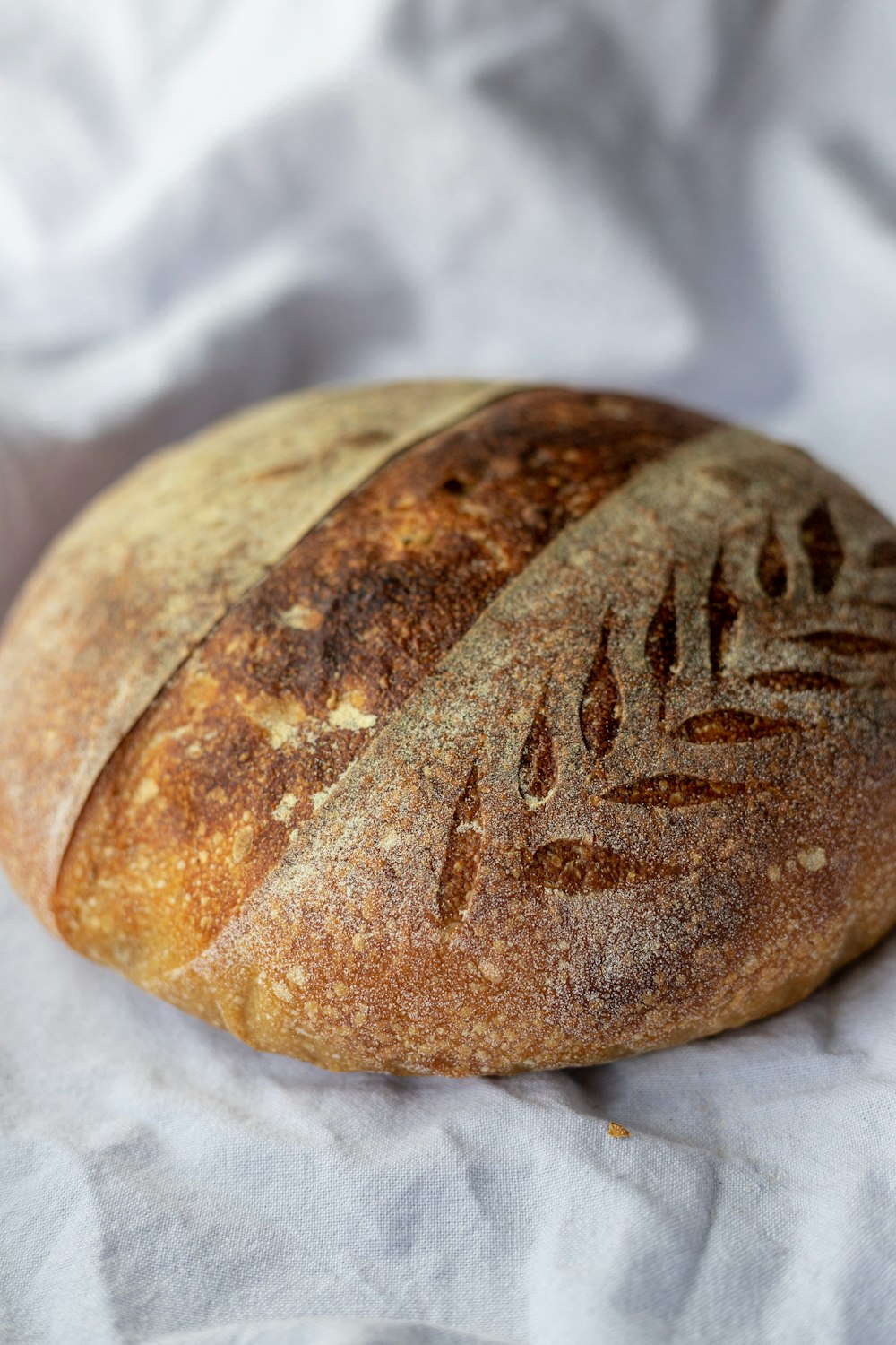 brown bread on white textile