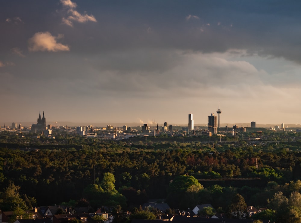 city skyline under gray cloudy sky during daytime