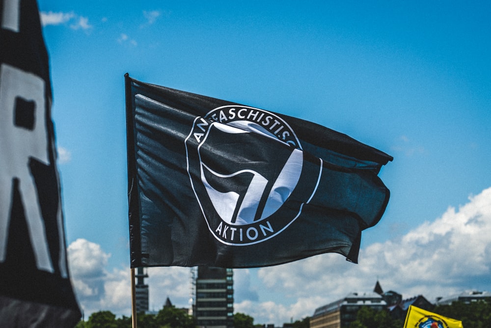 a black and white flag flying in the air