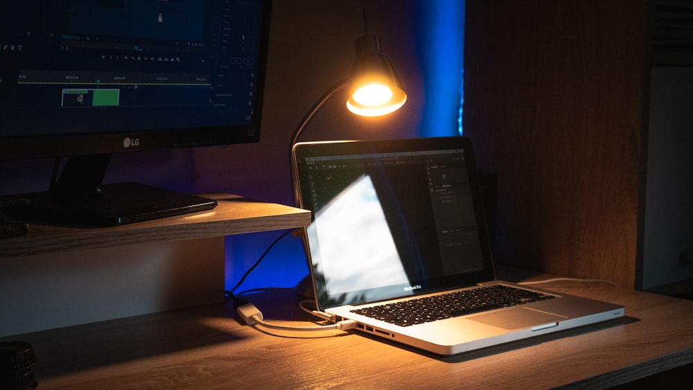 macbook pro on brown wooden table