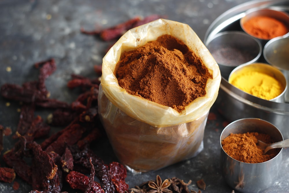 brown powder in clear glass cup