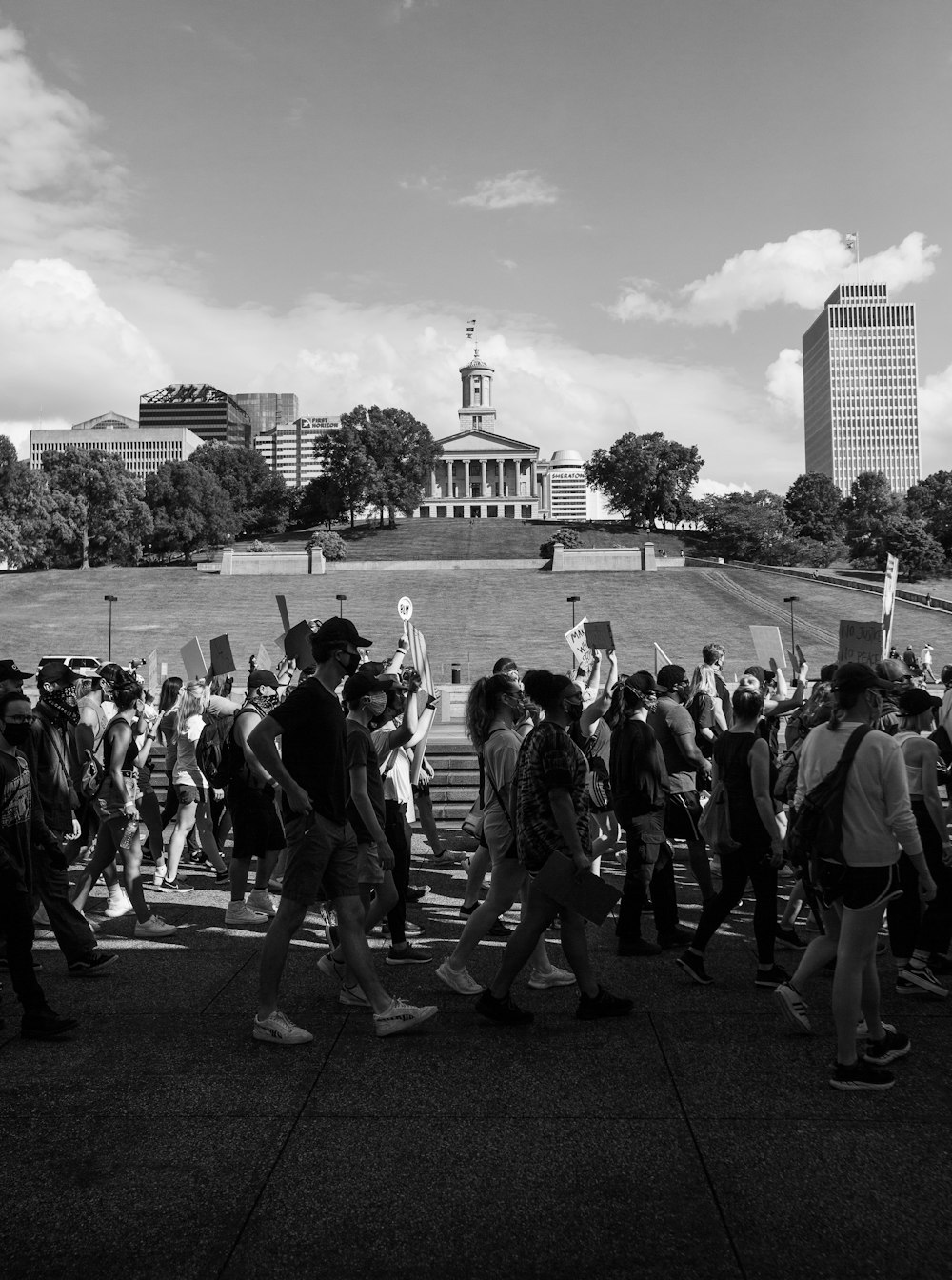 grayscale photo of people walking on street