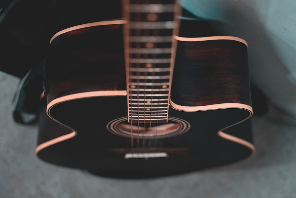 black and brown acoustic guitar