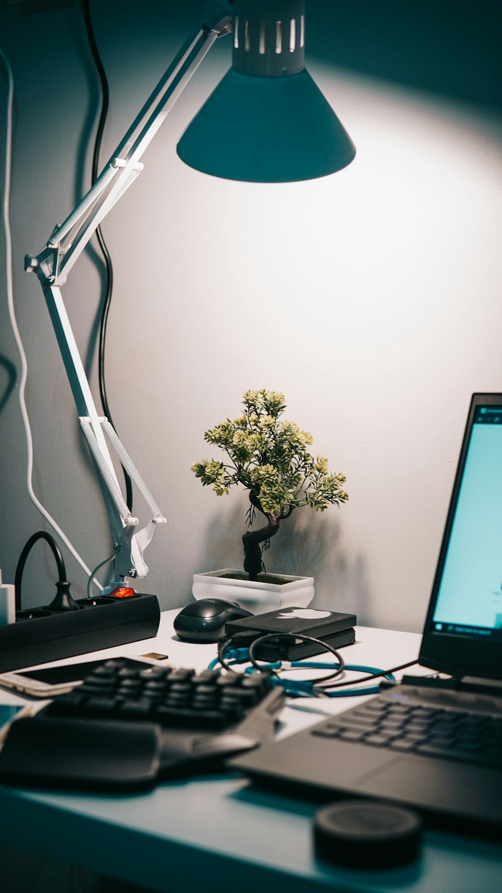 black laptop computer beside black and gray corded computer mouse