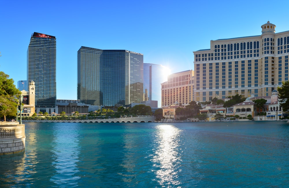 body of water near city buildings during daytime