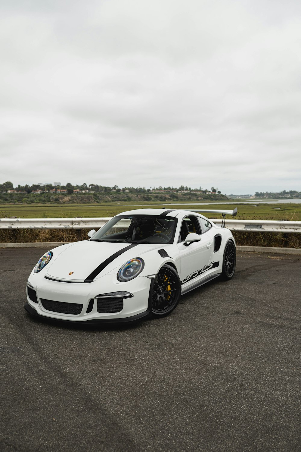 white porsche 911 on road during daytime