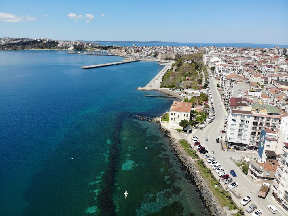 aerial view of city near body of water during daytime