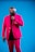 man in pink suit wearing sunglasses