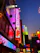A vibrant neon-lit cyberpunk street scene inspired by Tokyo, blending futuristic and traditional Japanese elements.