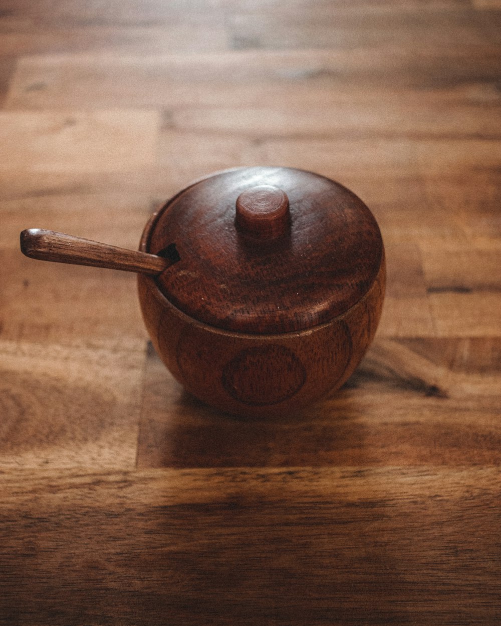 brown ceramic teapot on brown wooden table