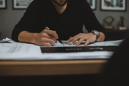 man in black long sleeve shirt using black laptop computer