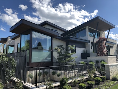 white and brown wooden house under blue sky during daytime