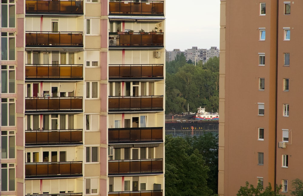 brown concrete building near green trees during daytime