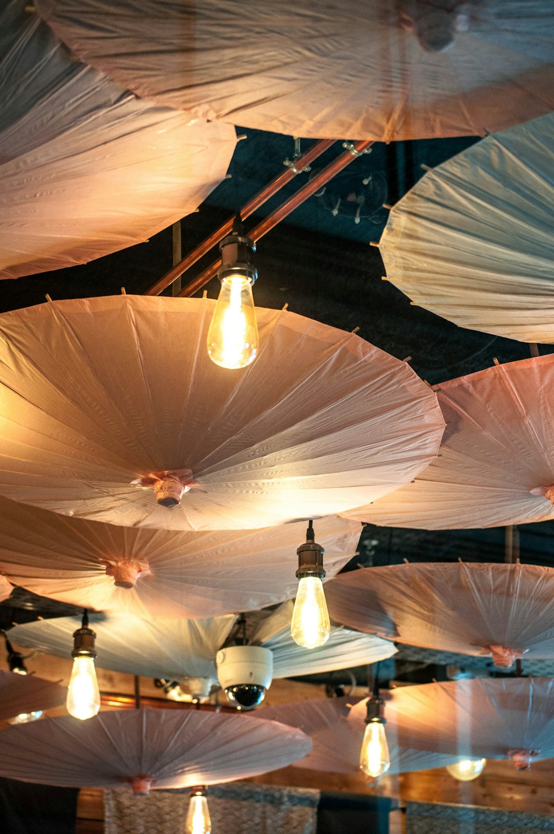 white and brown umbrella with light fixture