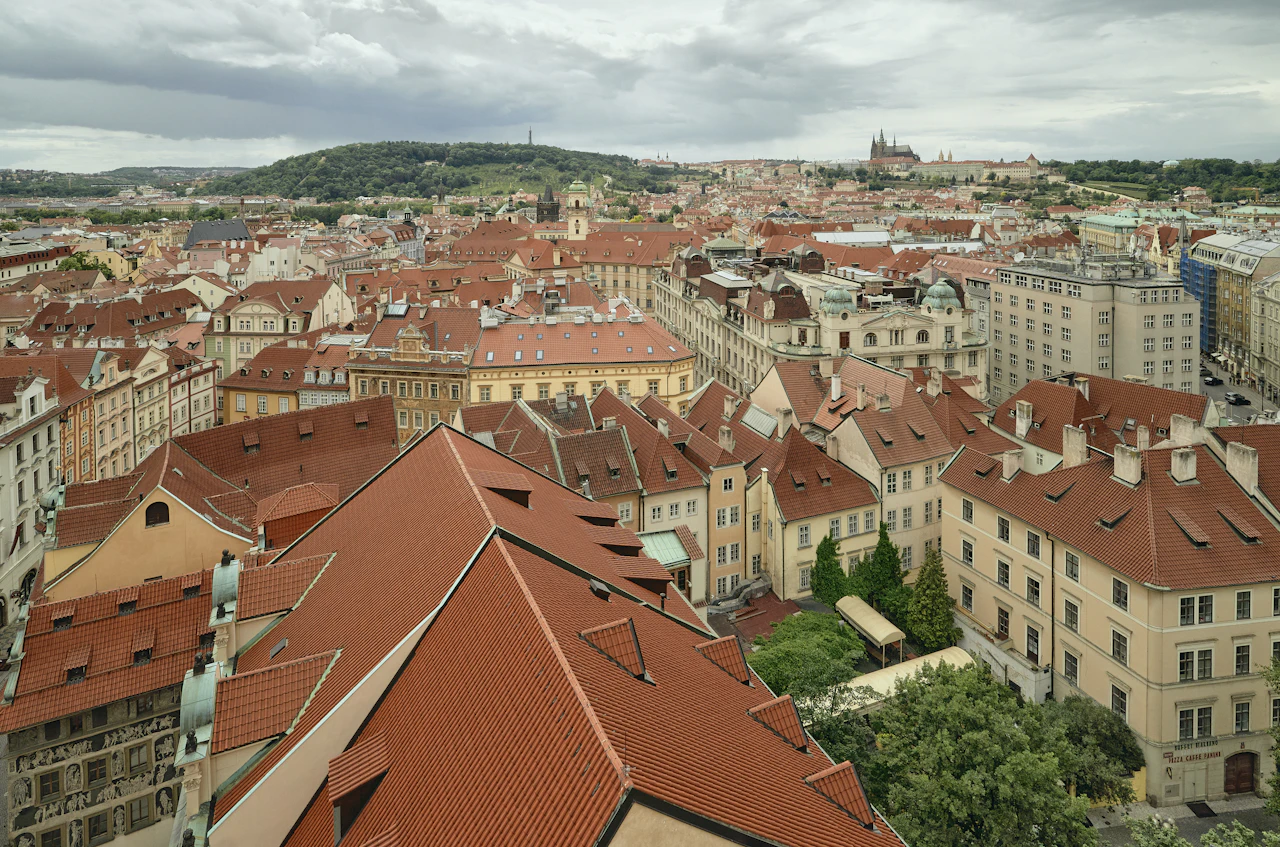 Red and white rooftops of an old hillside village seen from above