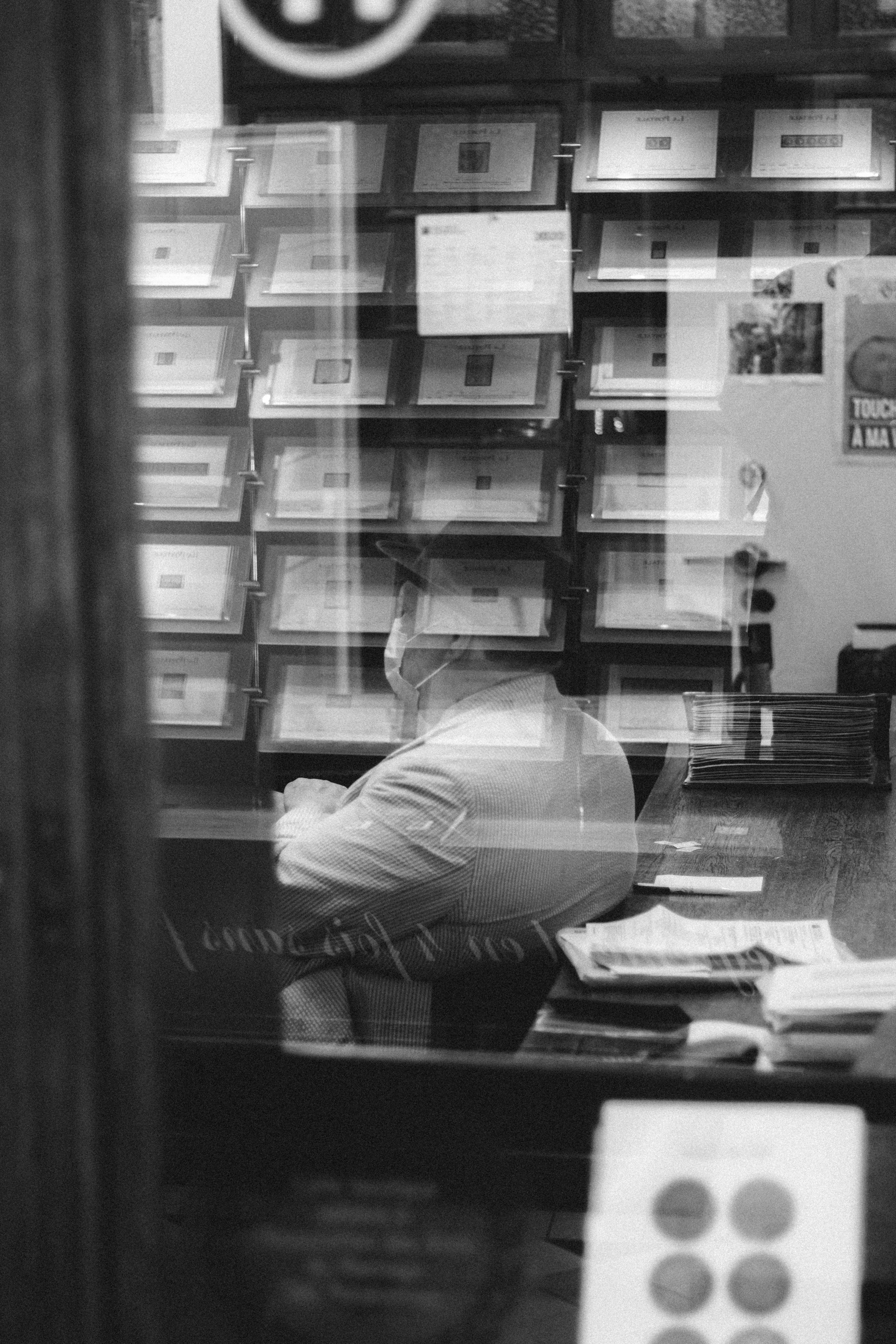 man in white dress shirt sitting on chair