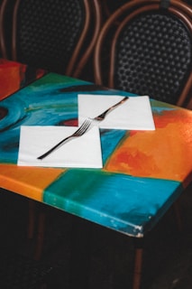 A vibrant collection of table linens in various colors.