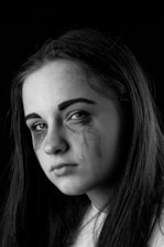 grayscale photo of womans face