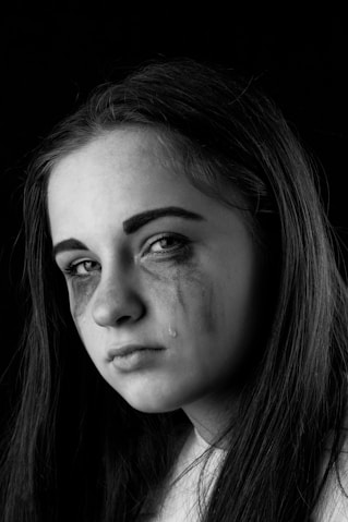 grayscale photo of womans face