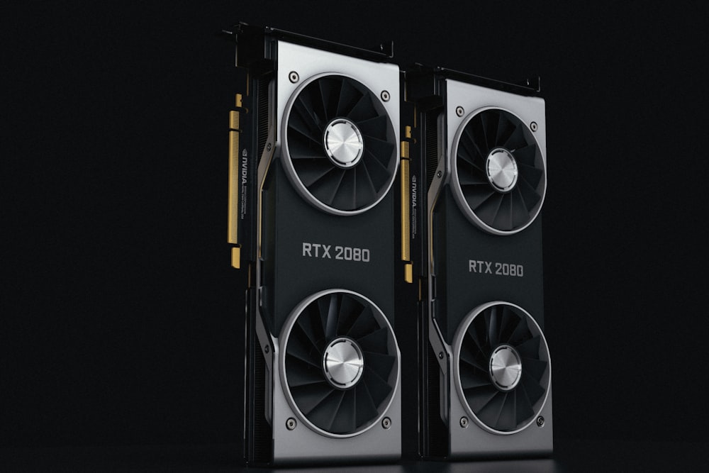 a pair of black and silver graphics cards