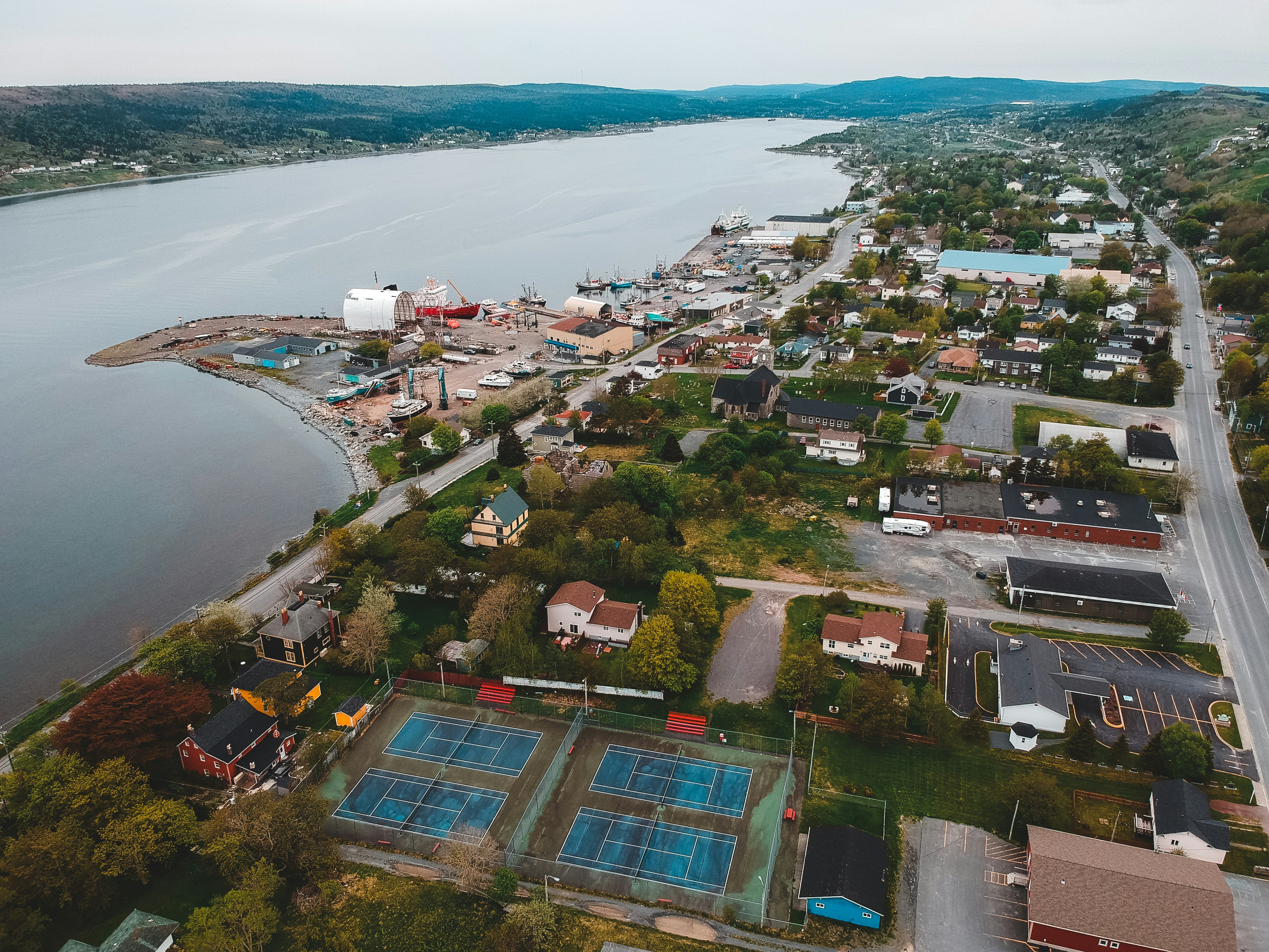 aerial view of city near body of water during daytime