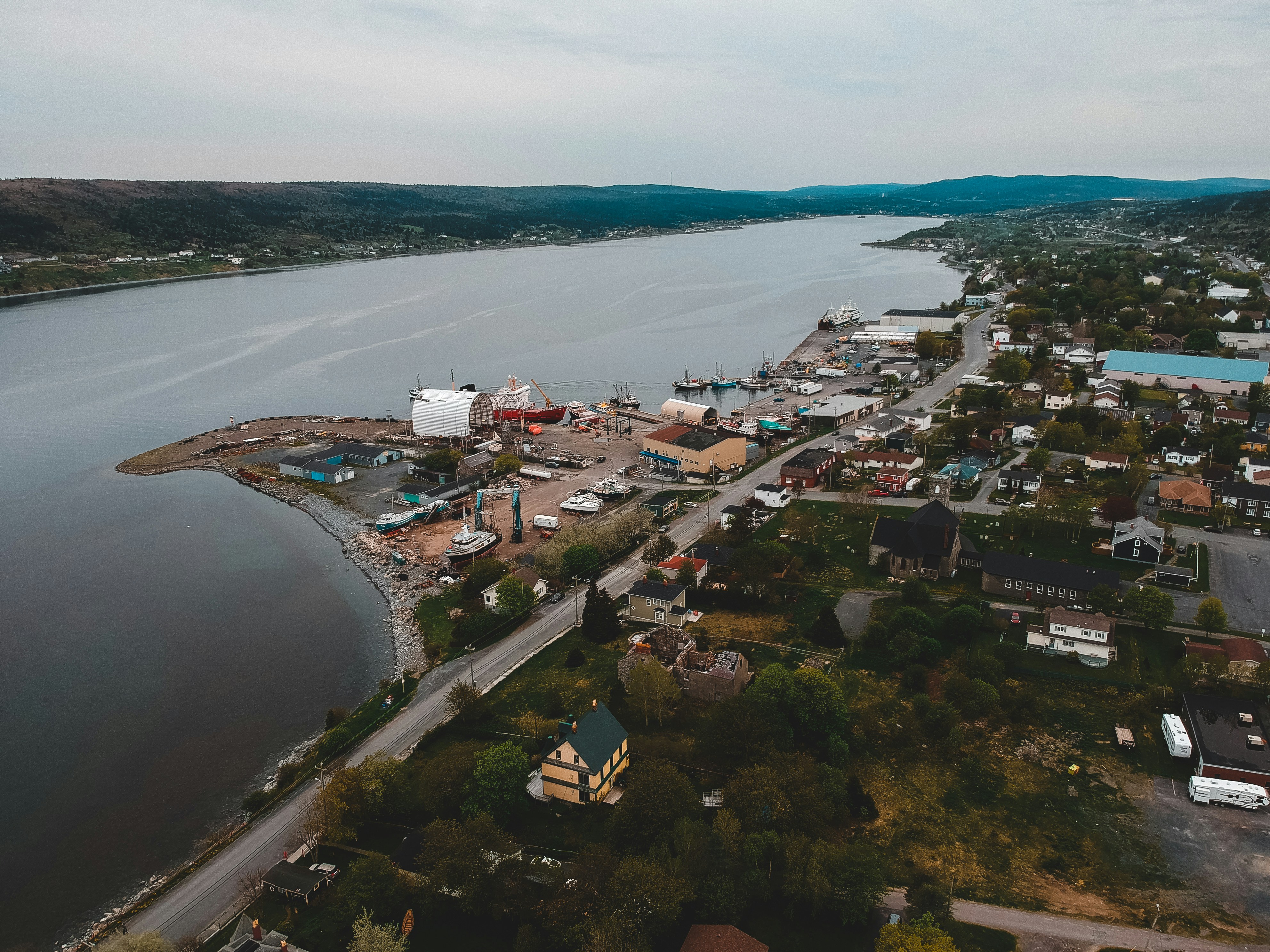 aerial view of city near body of water during daytime