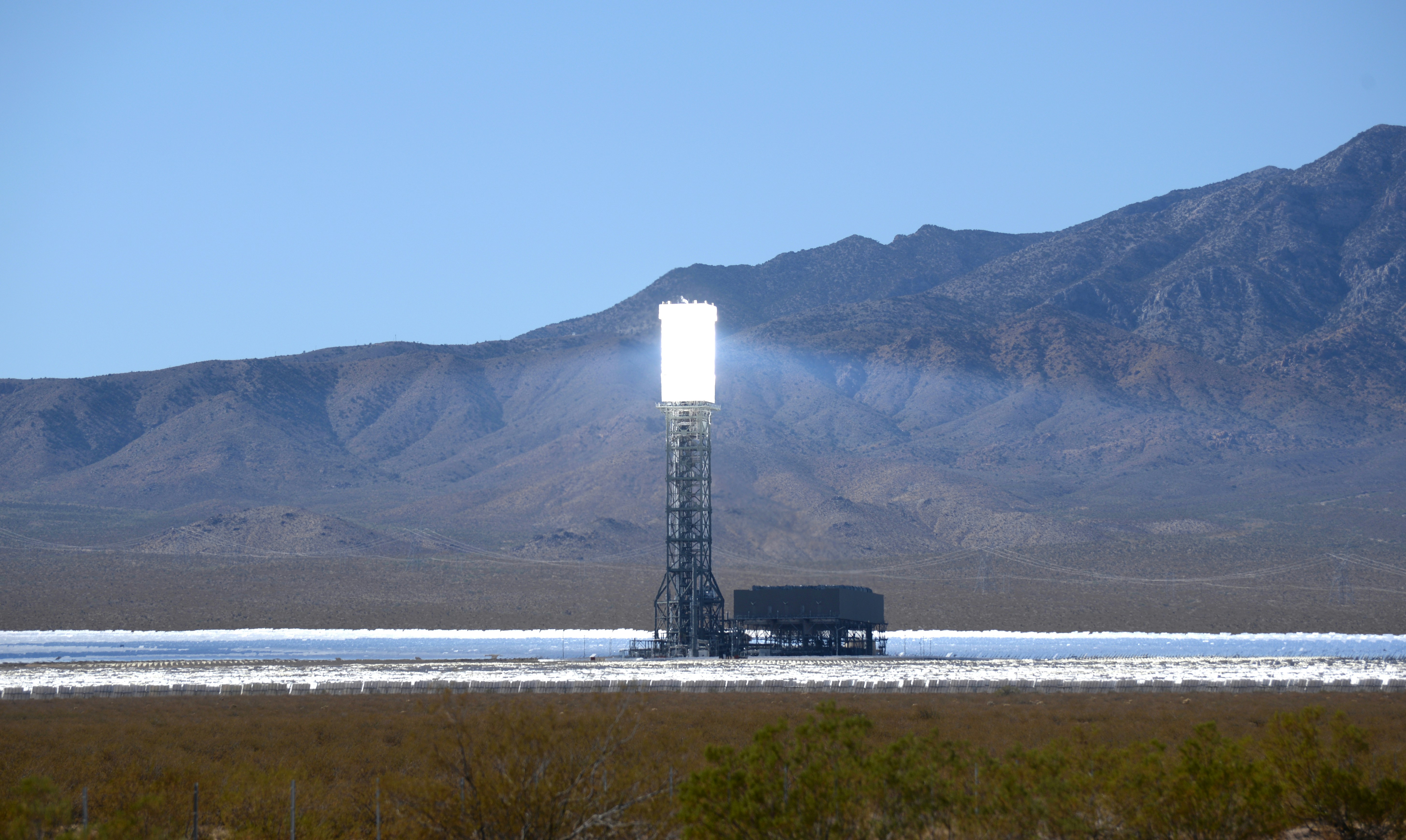 The Ivanpah Solar Power Facility is a concentrated solar thermal plant in the Mojave Desert near the California-Nevada border. Acres of heliostat mirrors direct sunlight onto receivers located in the 3 centralized solar towers. The receivers generate steam to drive turbines and generate power. When it opened in 2014, Ivanpah was the world's largest solar thermal power station. Last year (2019) it produced 772,214 MWh of electricity.