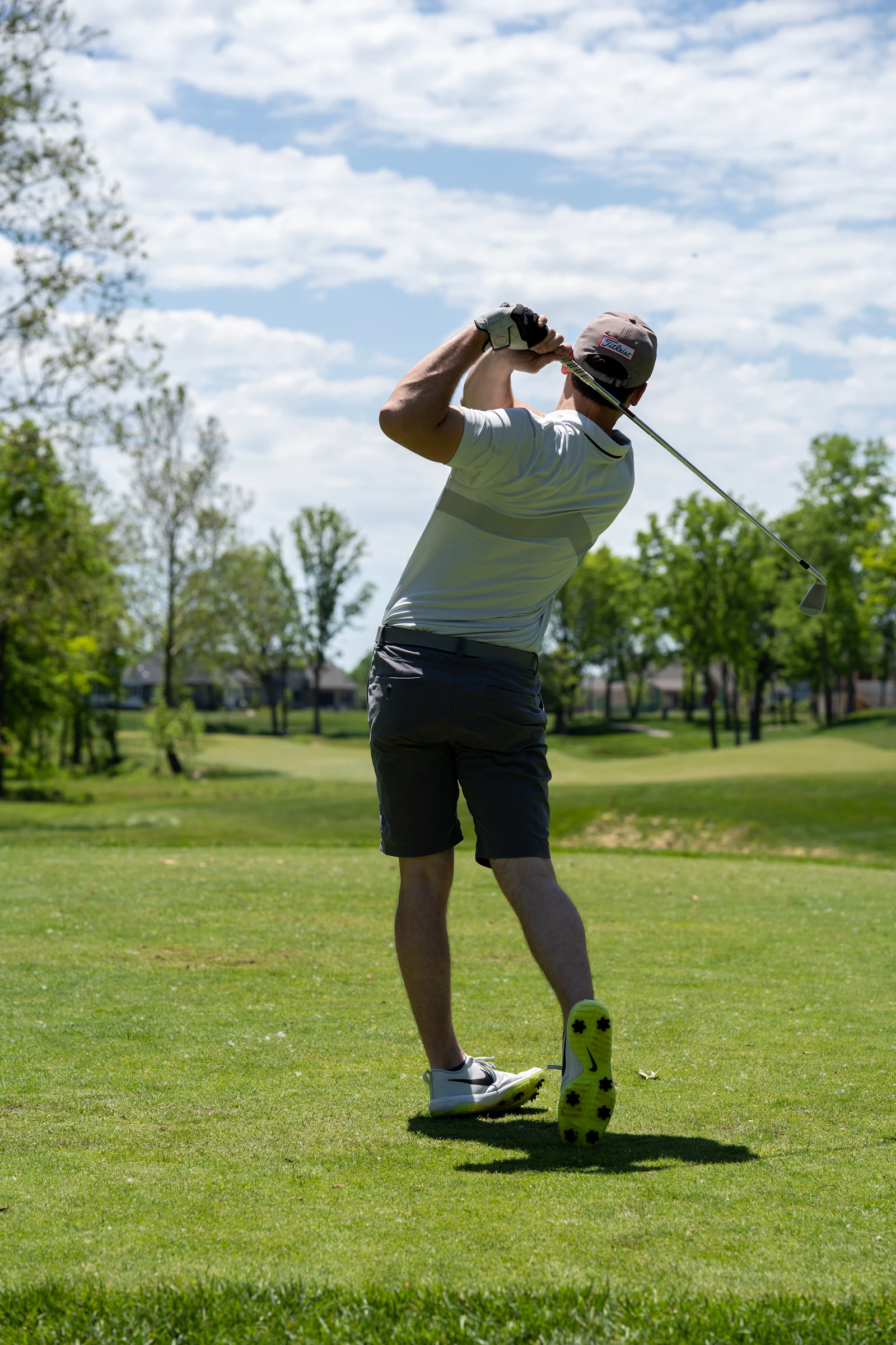 Golfer with club on the course
