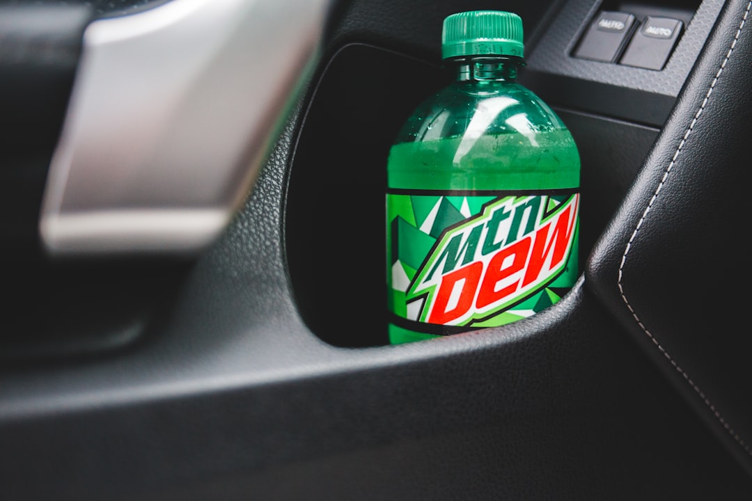 mountain dew plastic bottle on car dashboard