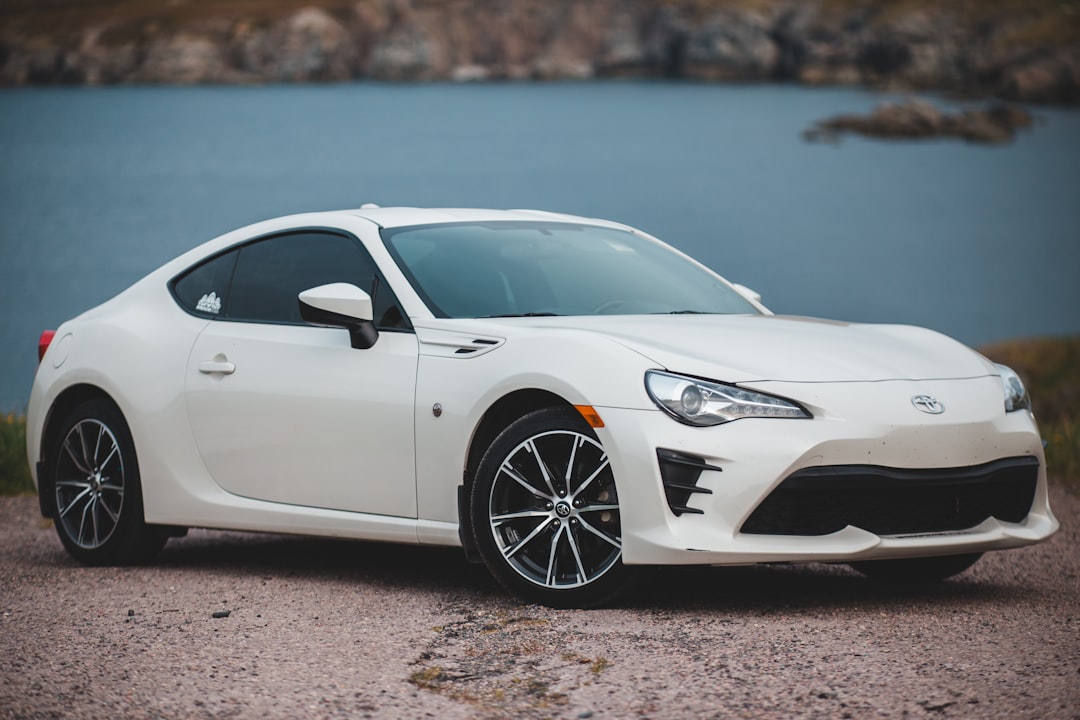 white mercedes benz coupe on brown sand during daytime