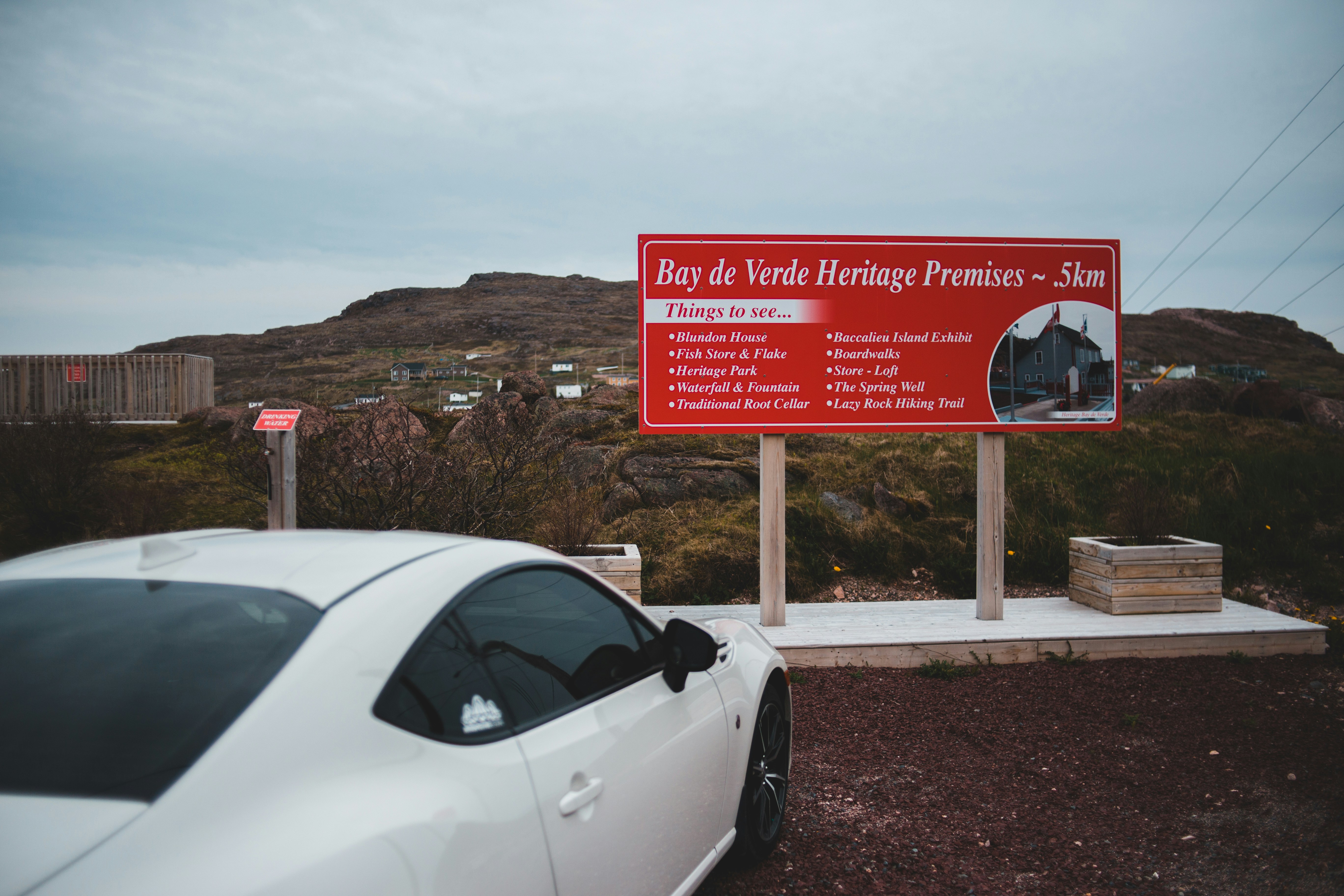 Family-sized luxury electric SUV parked at a charging station on a road trip