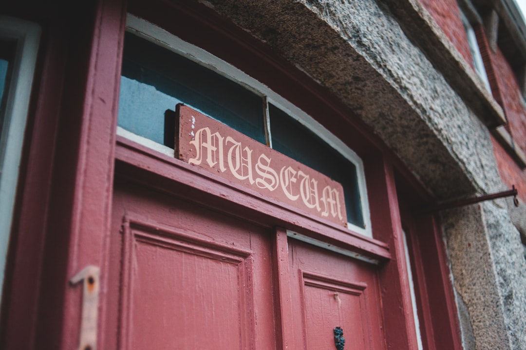 red wooden door with brown wooden frame