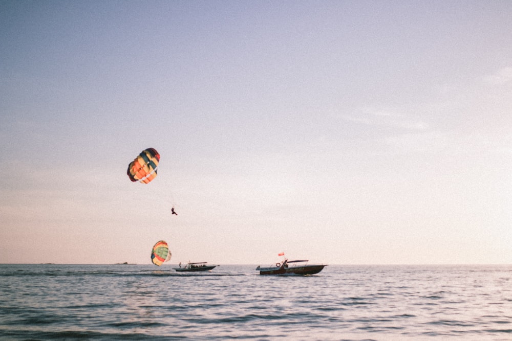 2 person riding on boat on sea during daytime