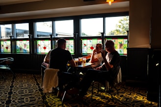 A lively trivia night in a cozy pub with smiling participants engaged in a quiz.