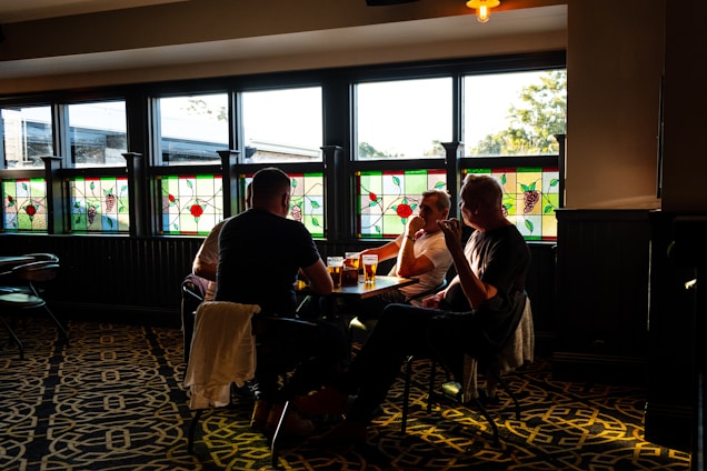 A lively trivia night in a cozy pub with smiling participants engaged in a quiz.