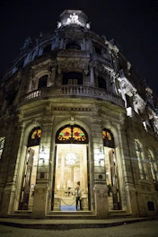 Grand Station hotel exterior view at sunset with welcoming entrance.