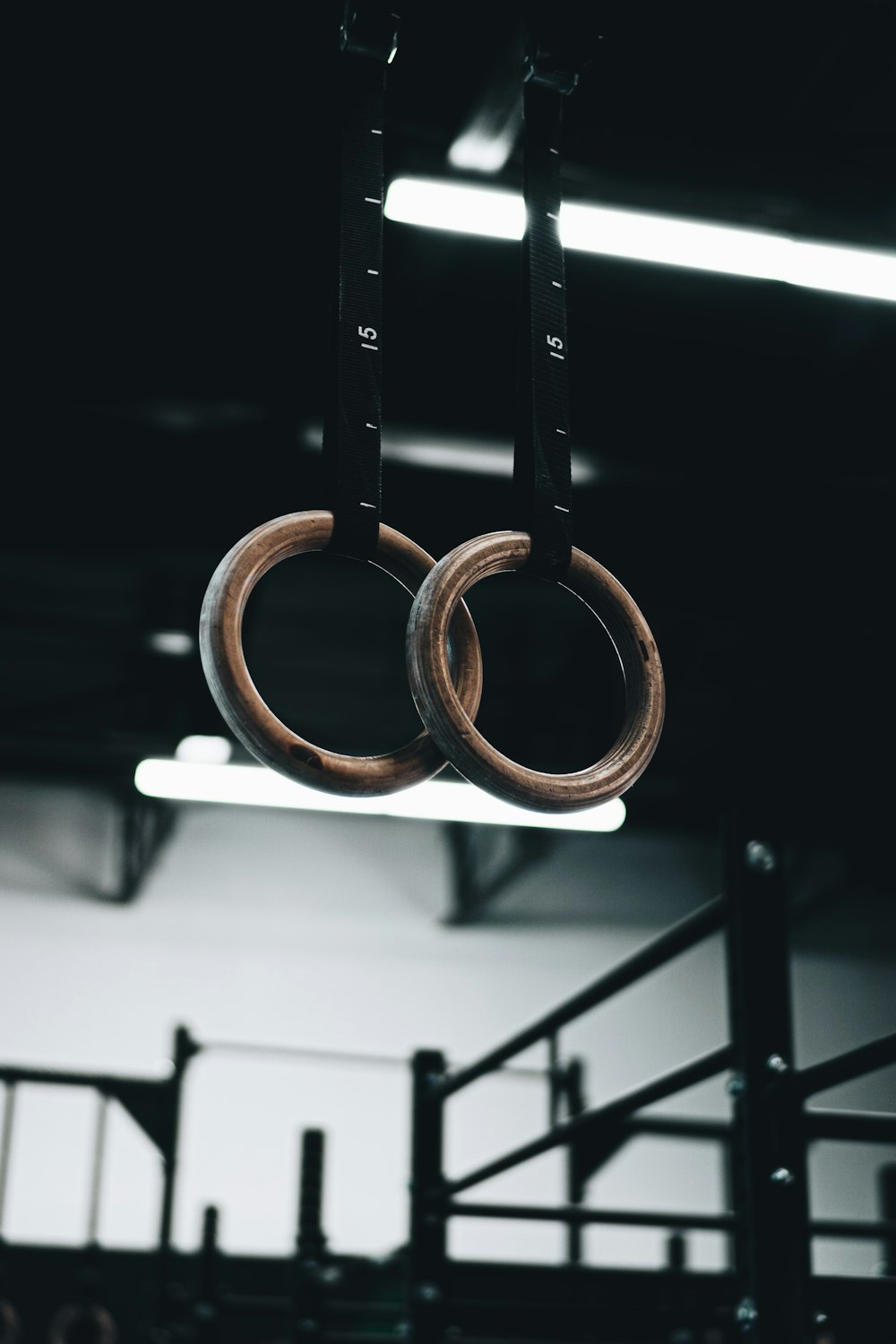 brown wooden ring on black metal bar