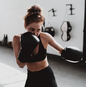 woman in black sports bra and black leggings doing exercise